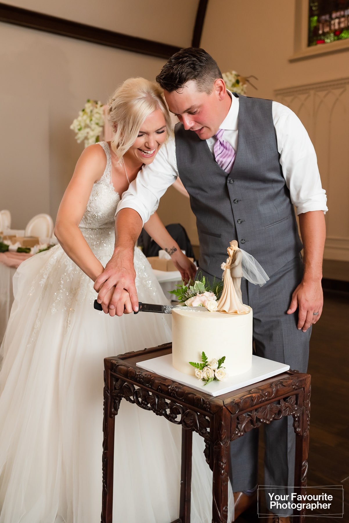 Bride and groom cake cutting