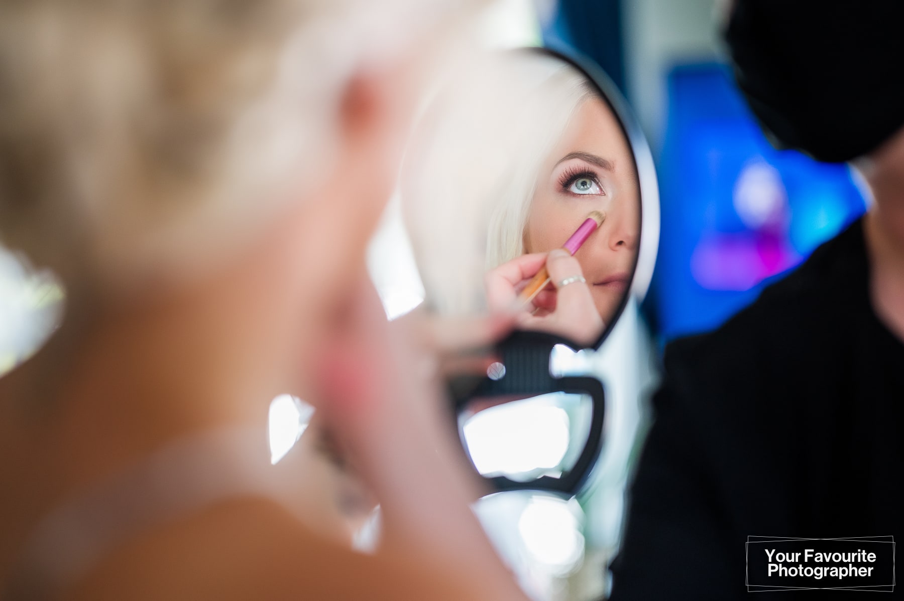 Bride looking at herself in a mirror
