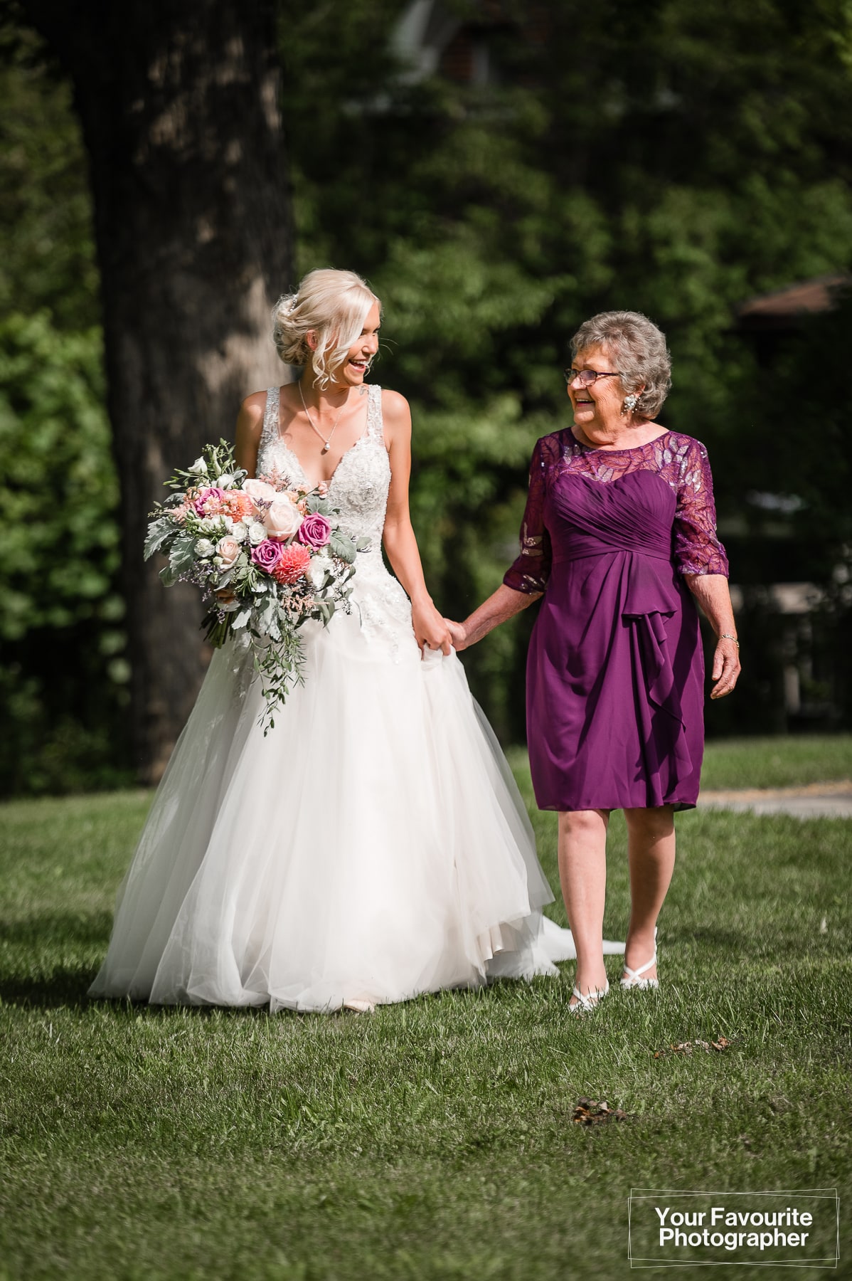 Bride and her grandma walking towards ceremony