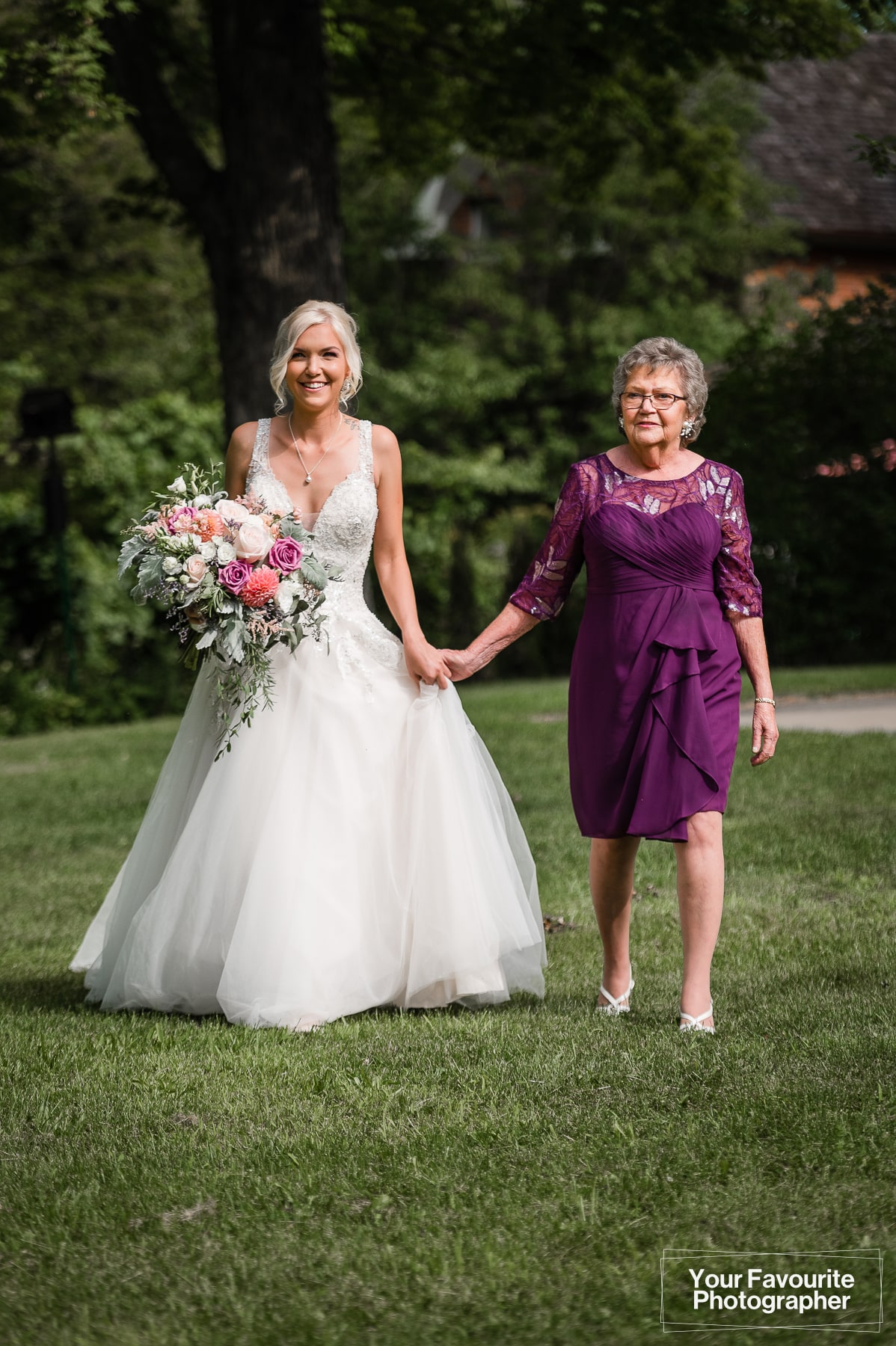 Bride and her grandma walking towards ceremony