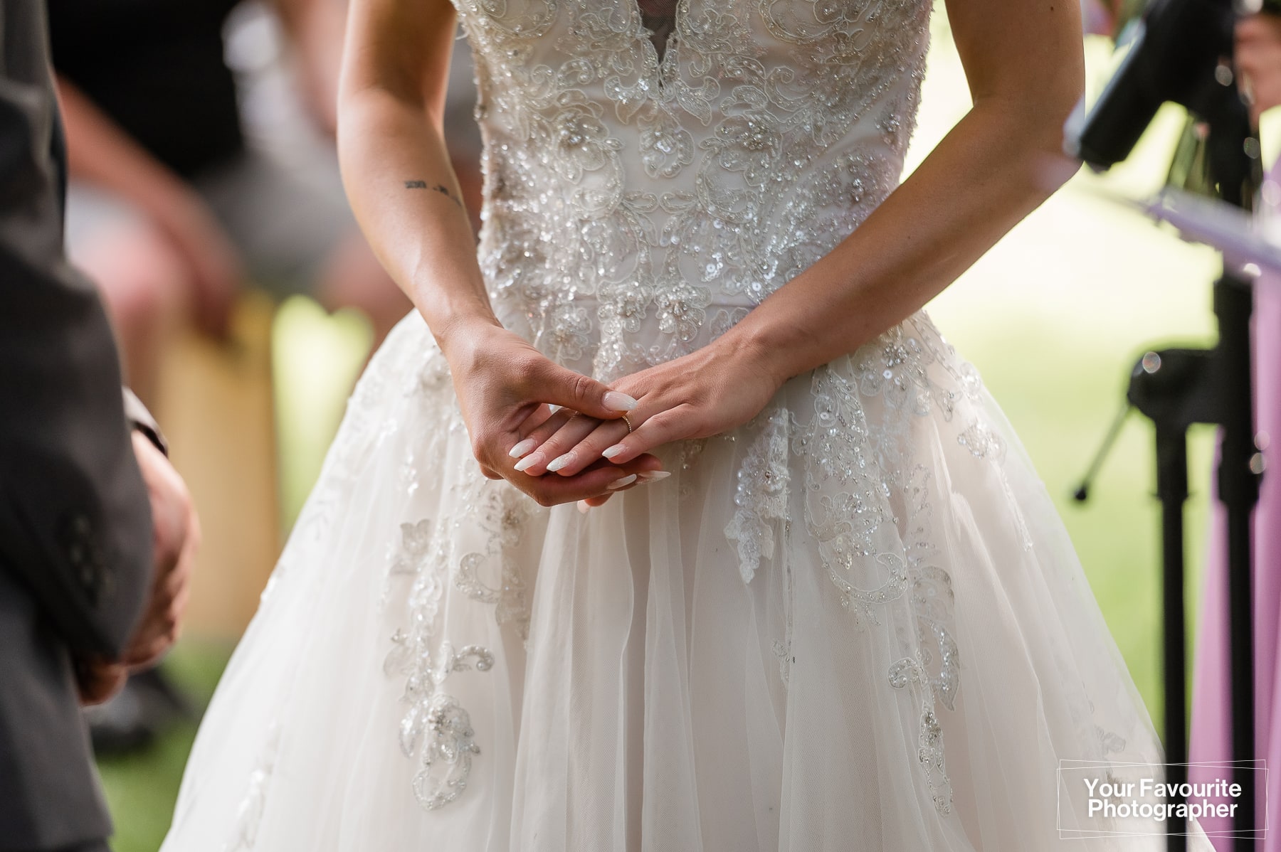 Bride's hands with wedding ring
