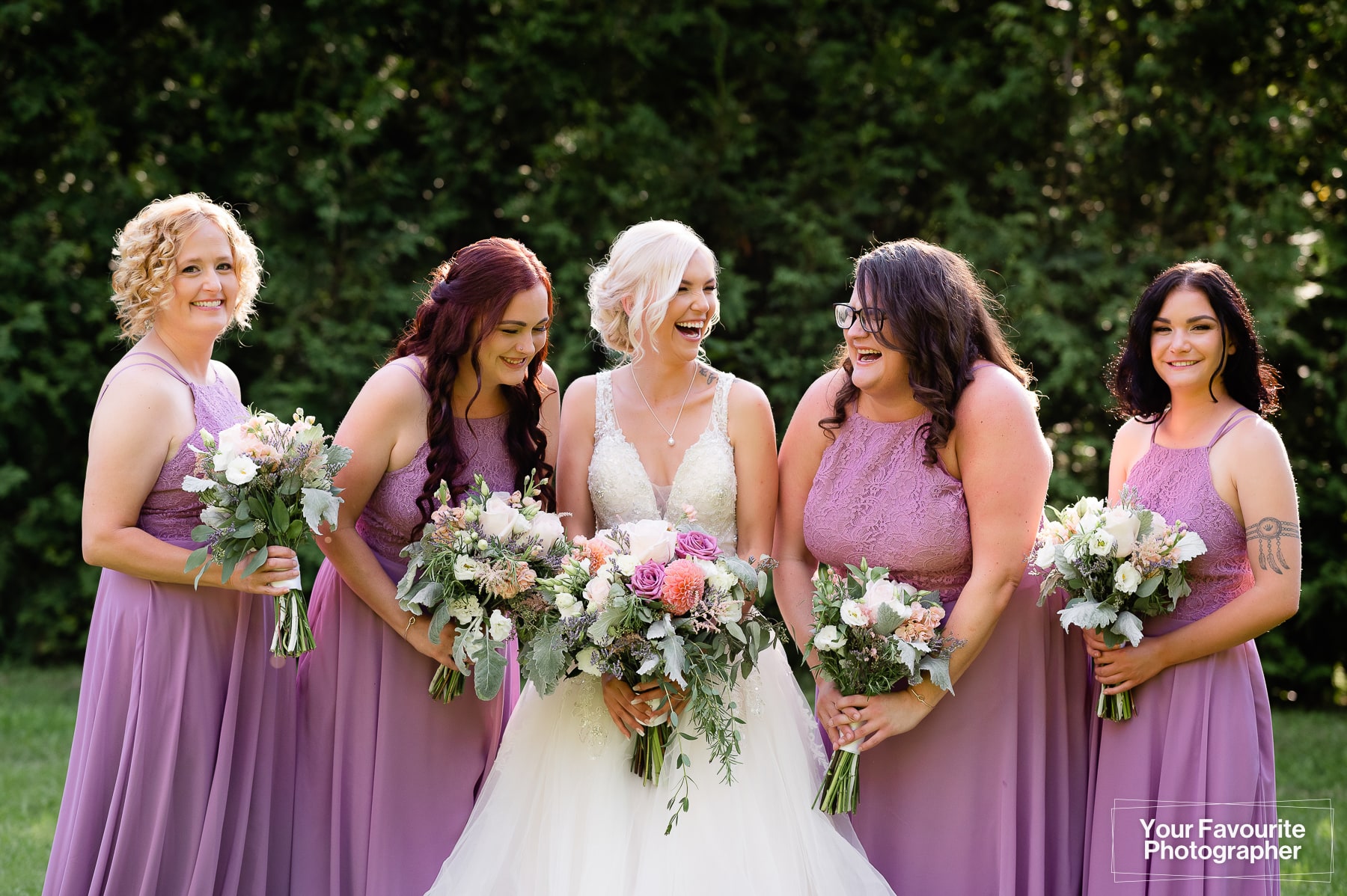 Candid bridesmaids laughing together