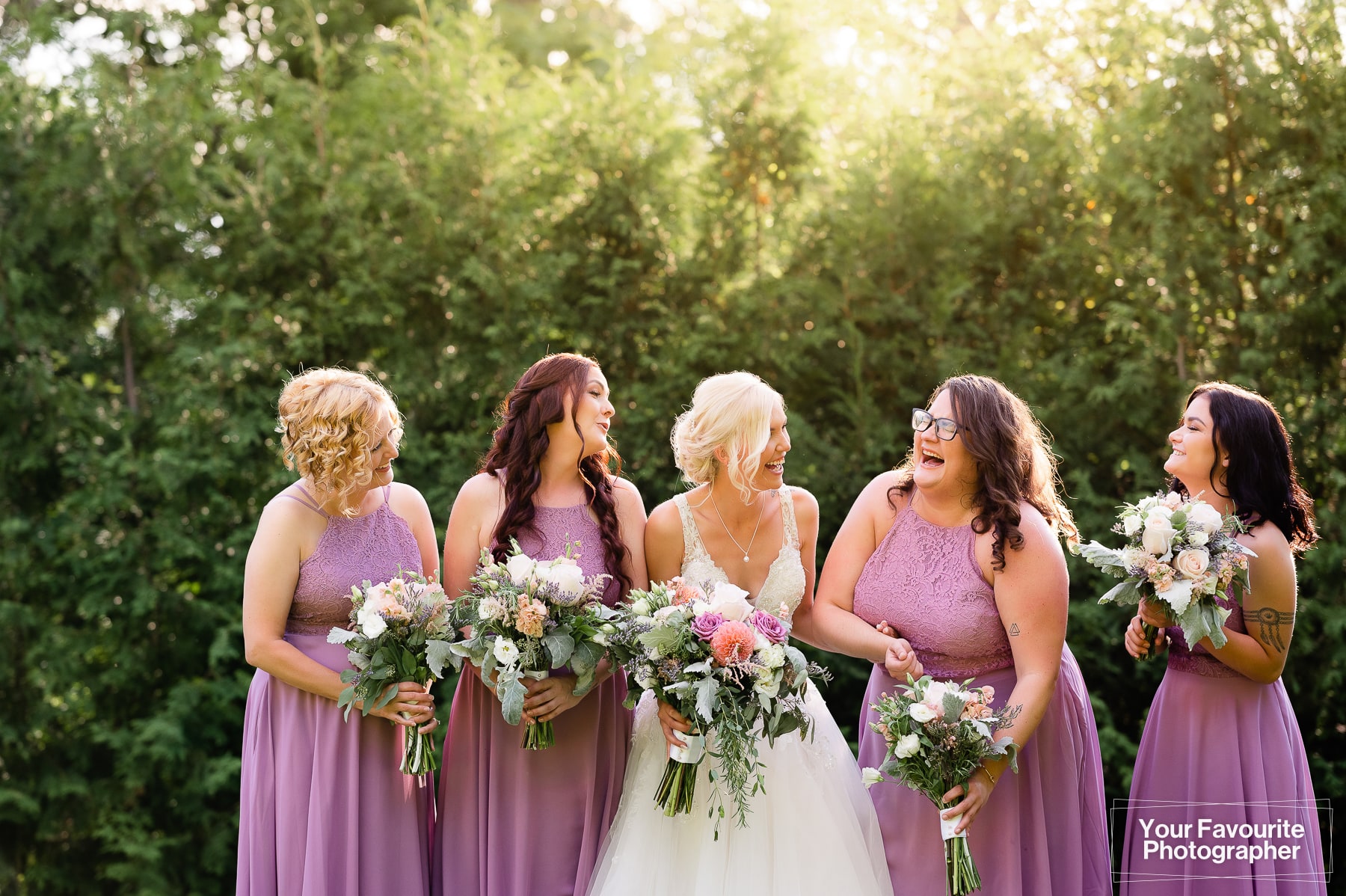 Candid bridesmaids laughing together