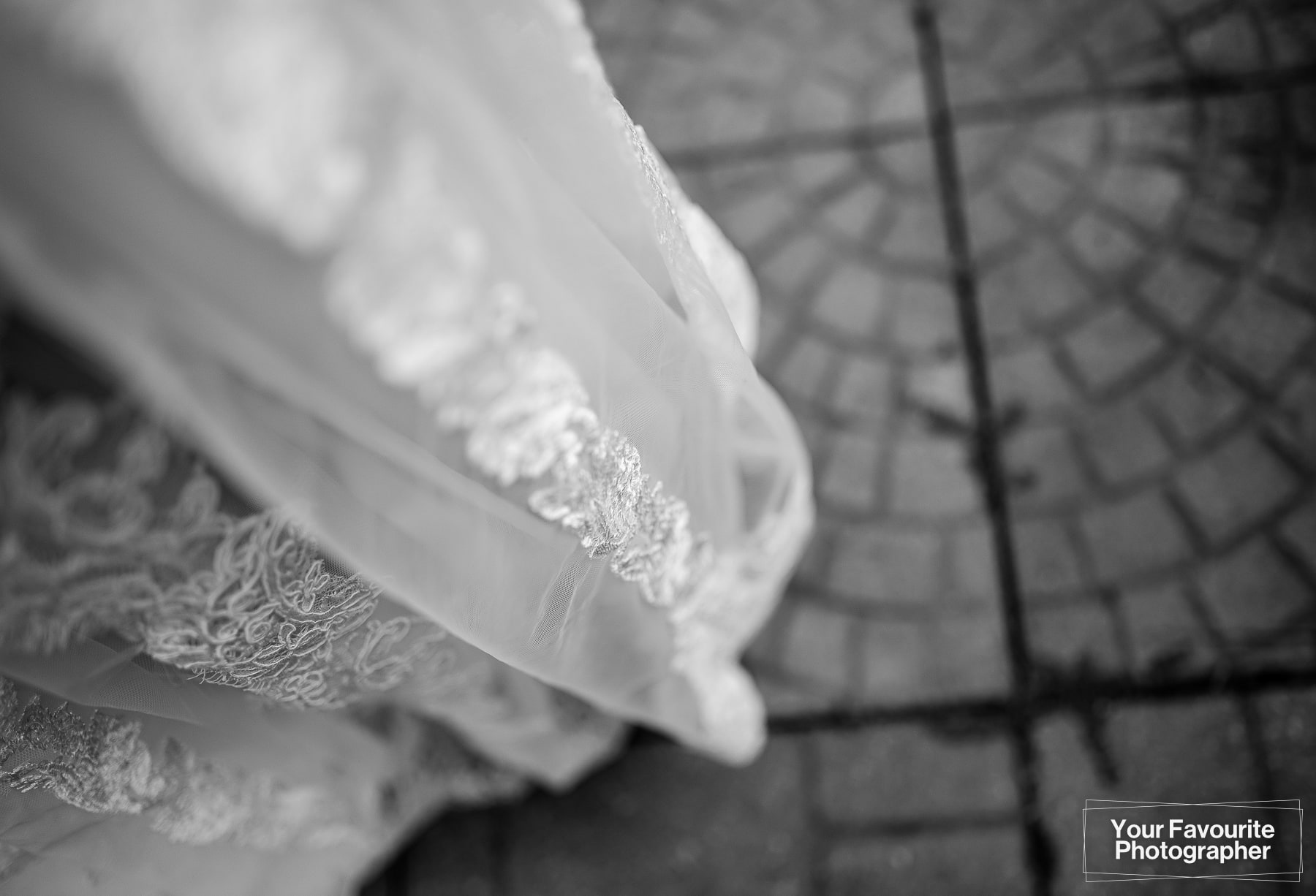 Lace detail of wedding dress in black and white