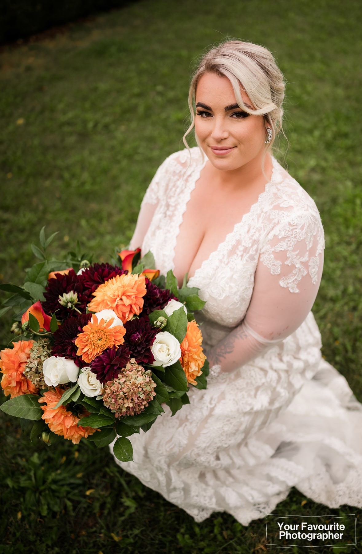 Bride posing with flowers
