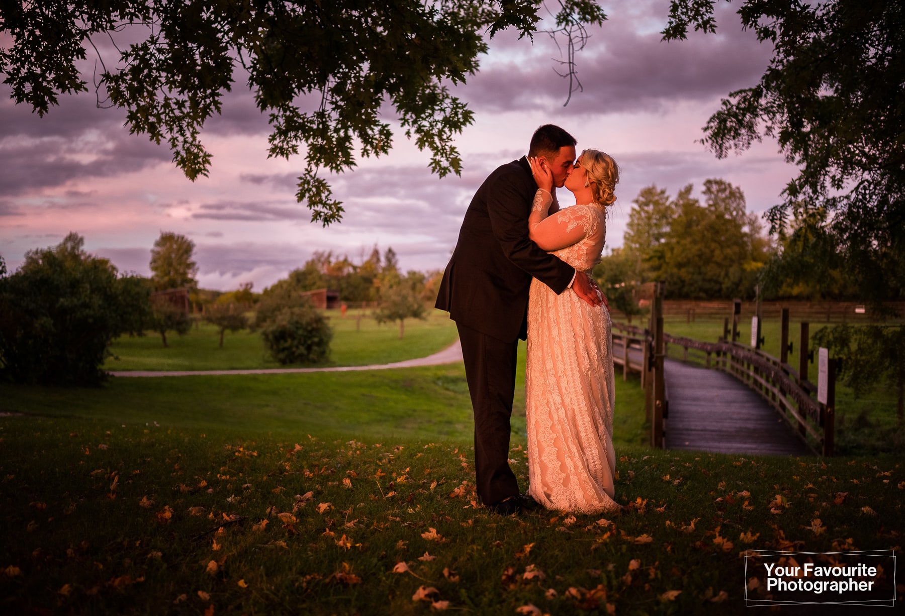 Sunset golden hour photo of bride and groom at farm