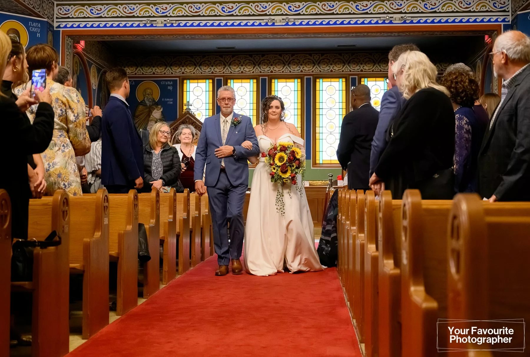 Bride and her father walk down the aisle at St. George's Greek Orthodox Church in downtown Toronto