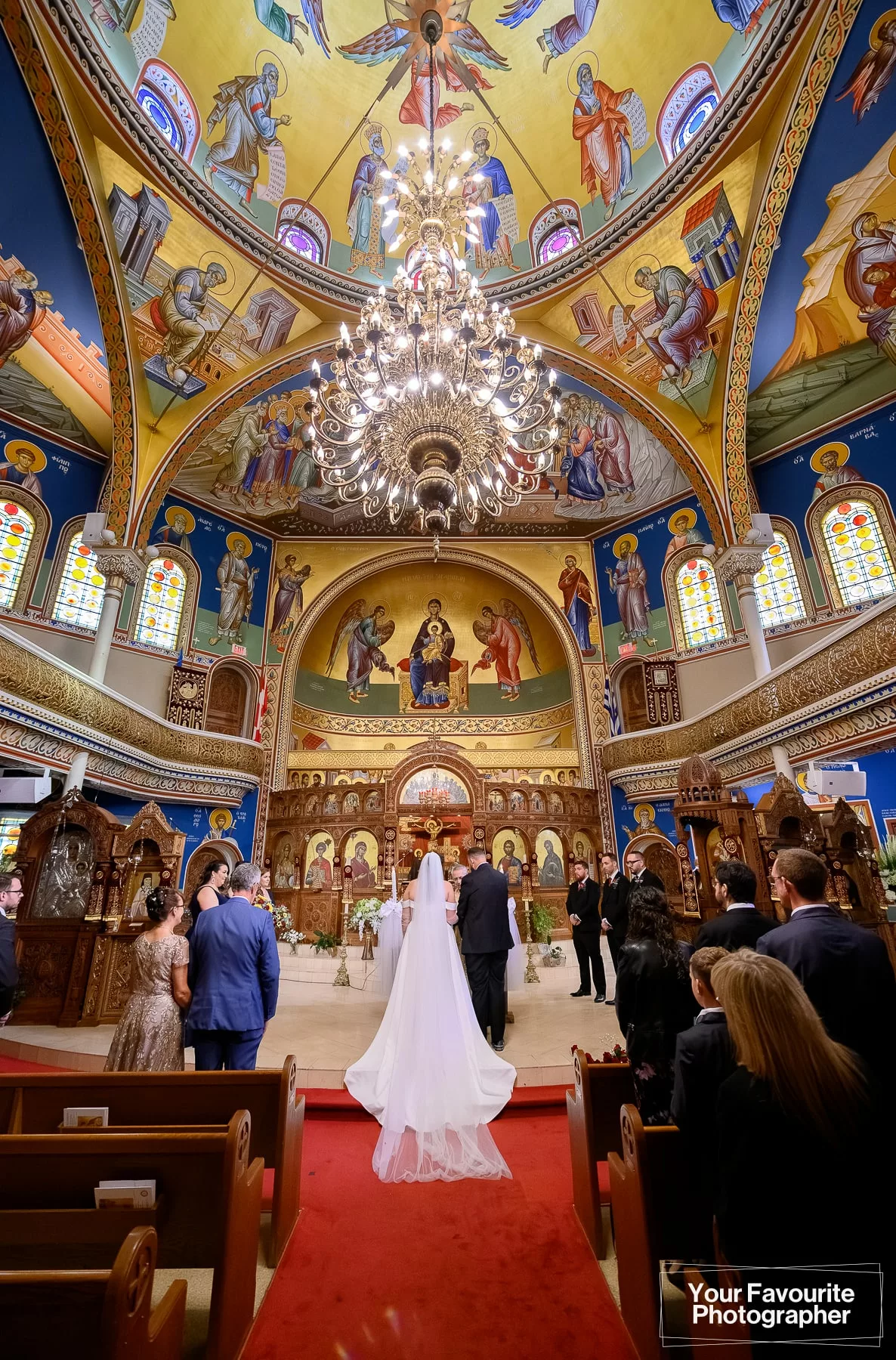 Couple getting married at St. George's Greek Orthodox Church in downtown Toronto. Wide angle view.