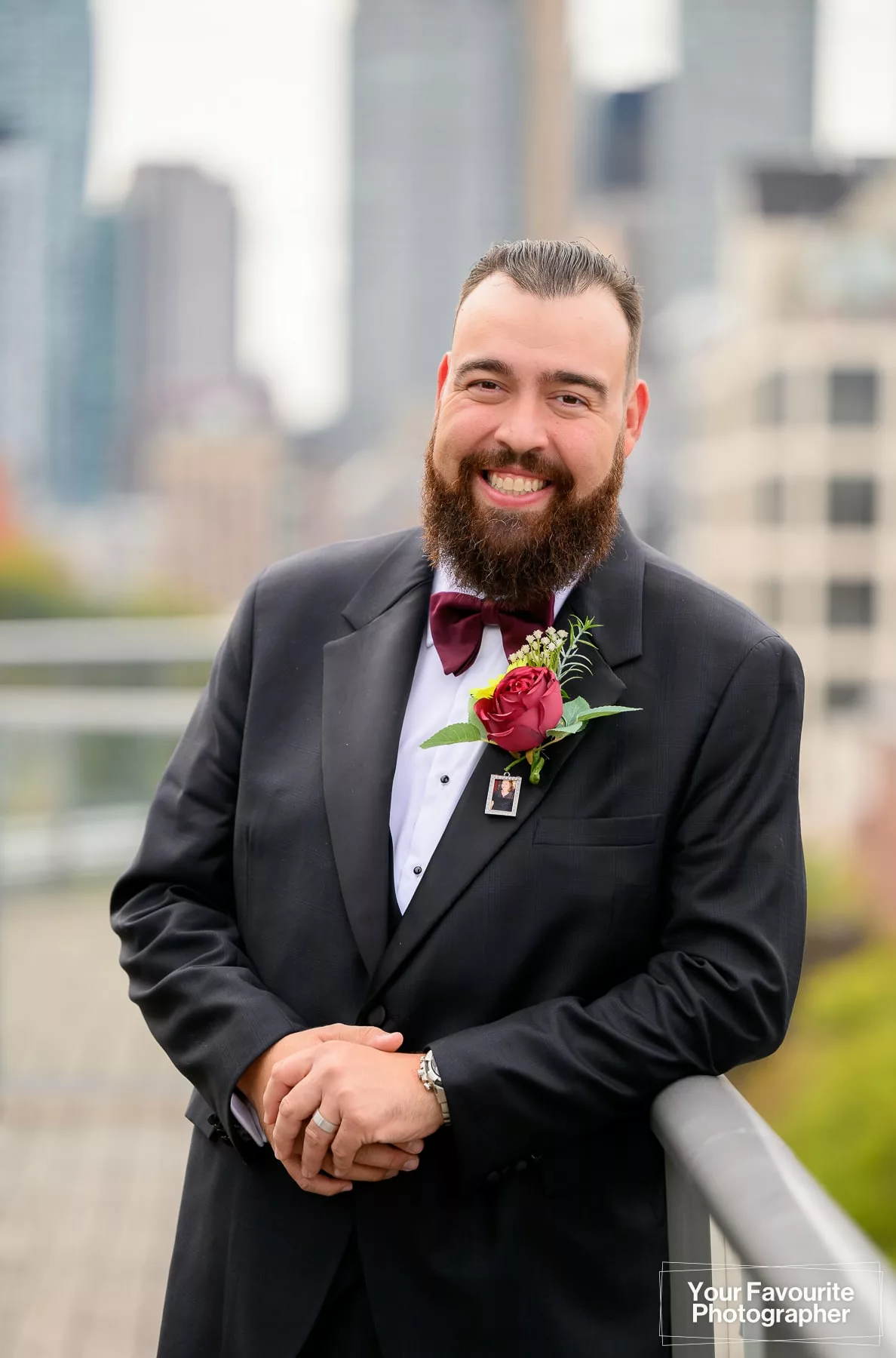 Portrait of a groom, outdoors, in front of the Downtown Toronto skyline