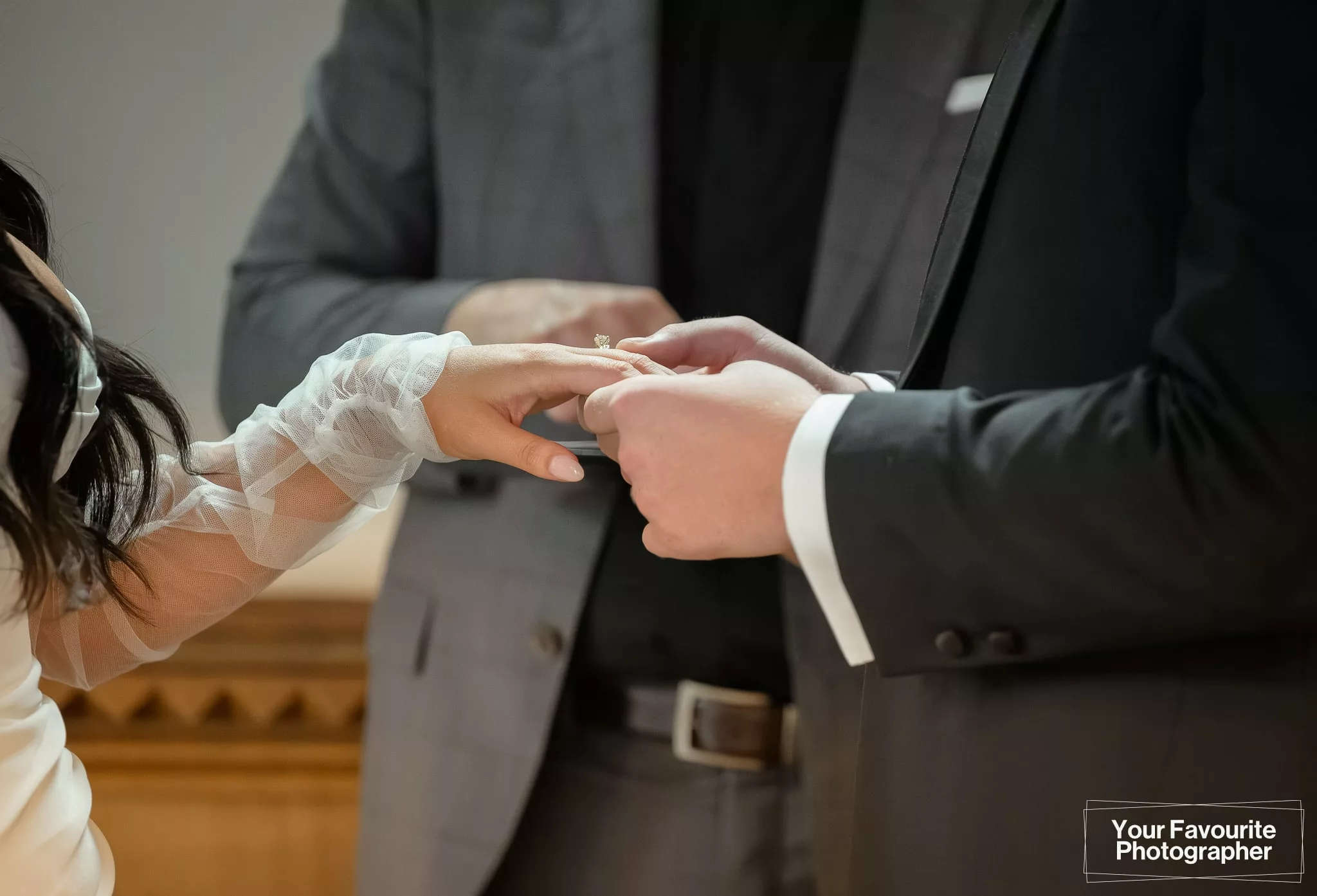Closeup of a bride and groom exchanging rings